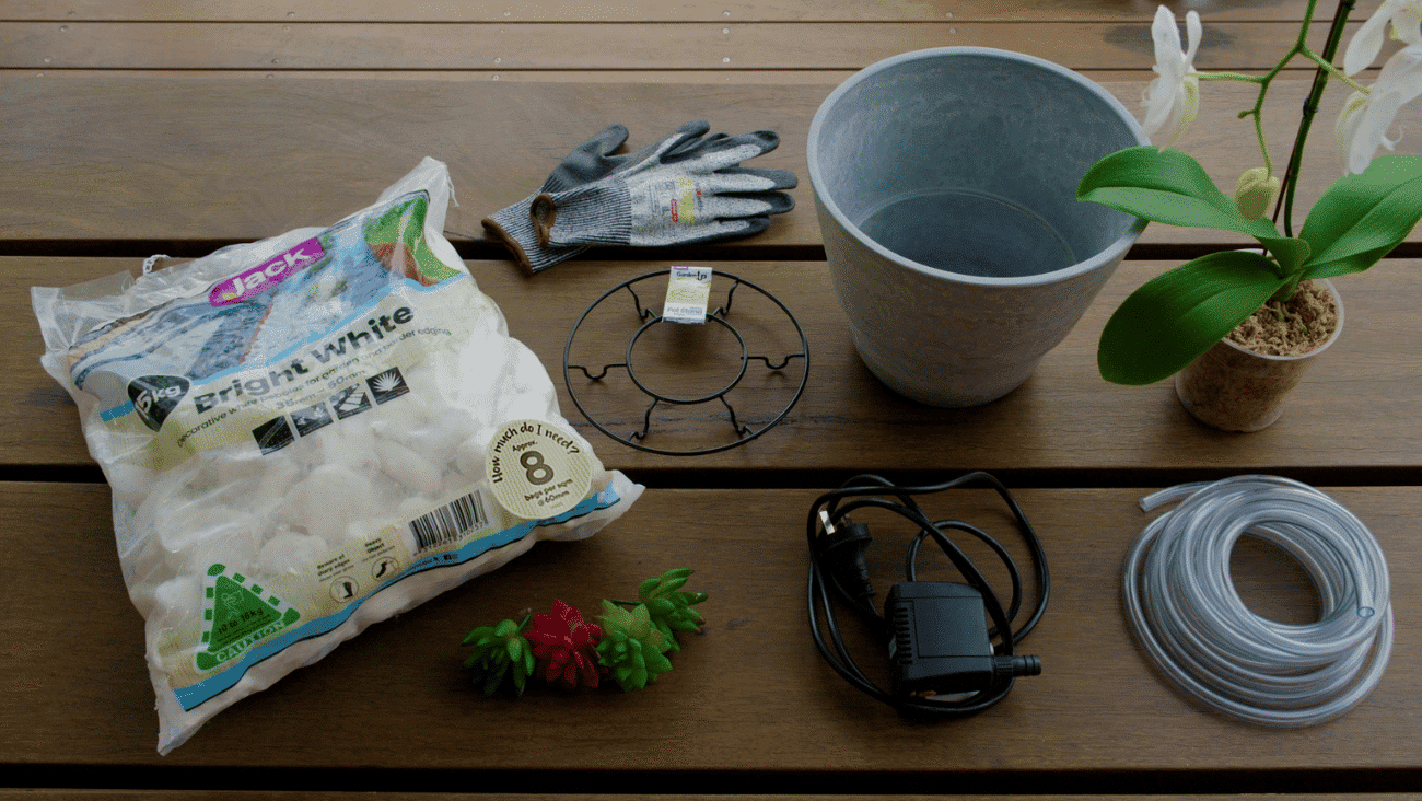 Create a simple Zen water fountain with landscaping rocks