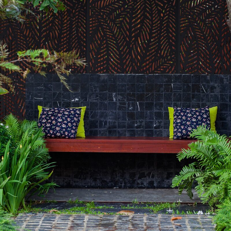 Afternoon tea set and pillows on outdoor wooden.terrace in garden .relax corner in house
