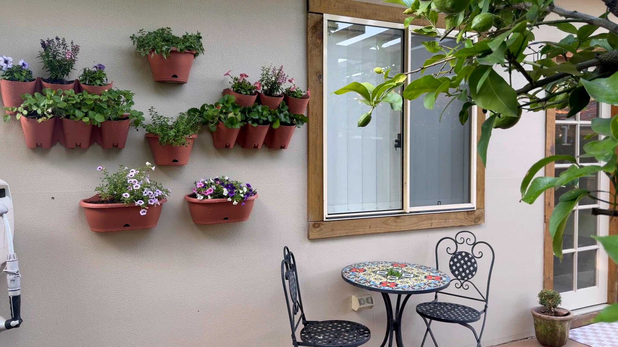 Side view of a wall-mounted vertical herb garden
