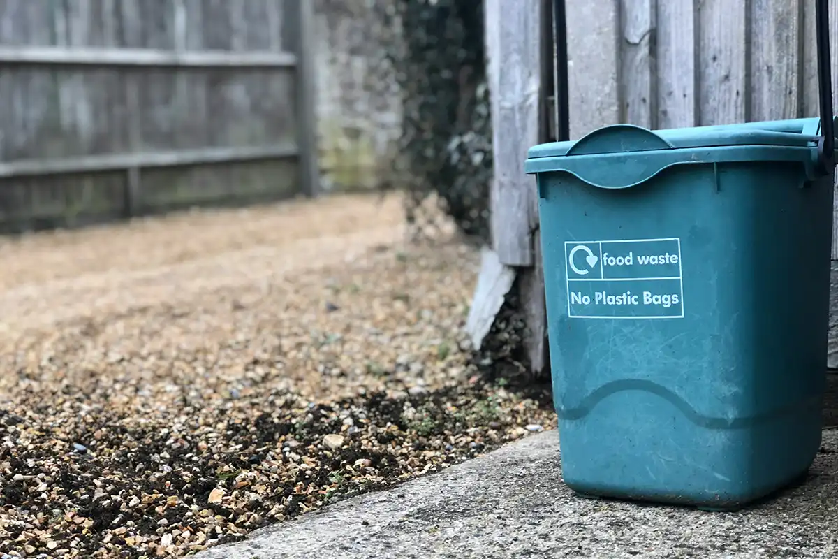 Eco-friendly compost bin for home garden composting, helping with organic waste disposal.